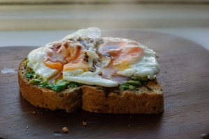 Toast with avocado, fried egg and soy sauce